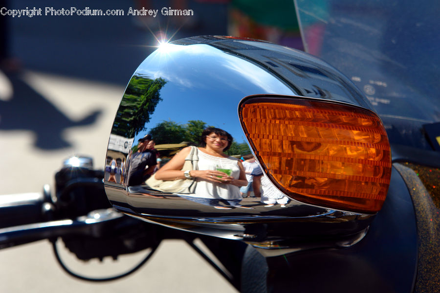 People, Person, Human, Car Mirror, Mirror, Headlight, Light