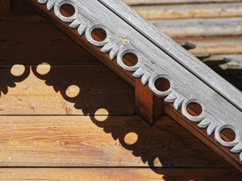 Carved wooden end of the roof.