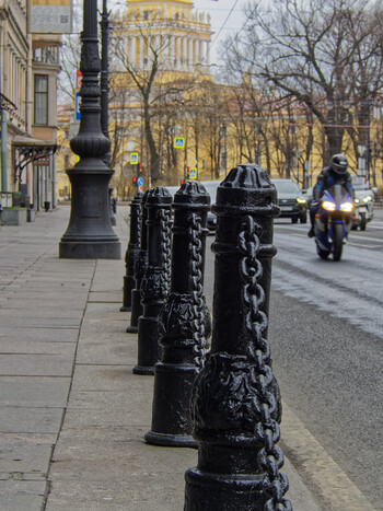 Cast-iron sidewalk fence.