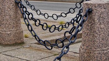 Cast-iron chains and granite curbstones.