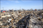 Mikhail & Ella Kusayev : The fire destroyed more then 100 houses during Hurricane Sandy in the flooded neighborhood at Breezy Point in Far Rockaway area on October 29; 2012 